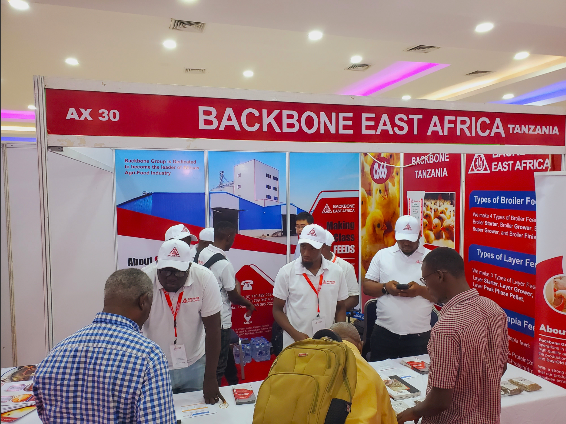 Farmers visit the Backbone Tanzania exhibition booth.